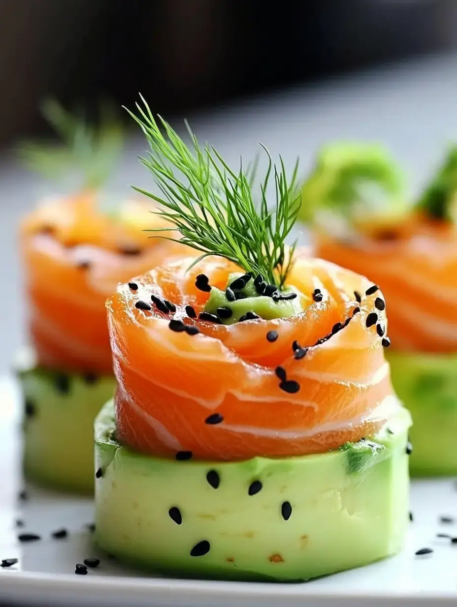 A close-up of colorful sushi rolls made with salmon and avocado, garnished with black sesame seeds and fresh dill.