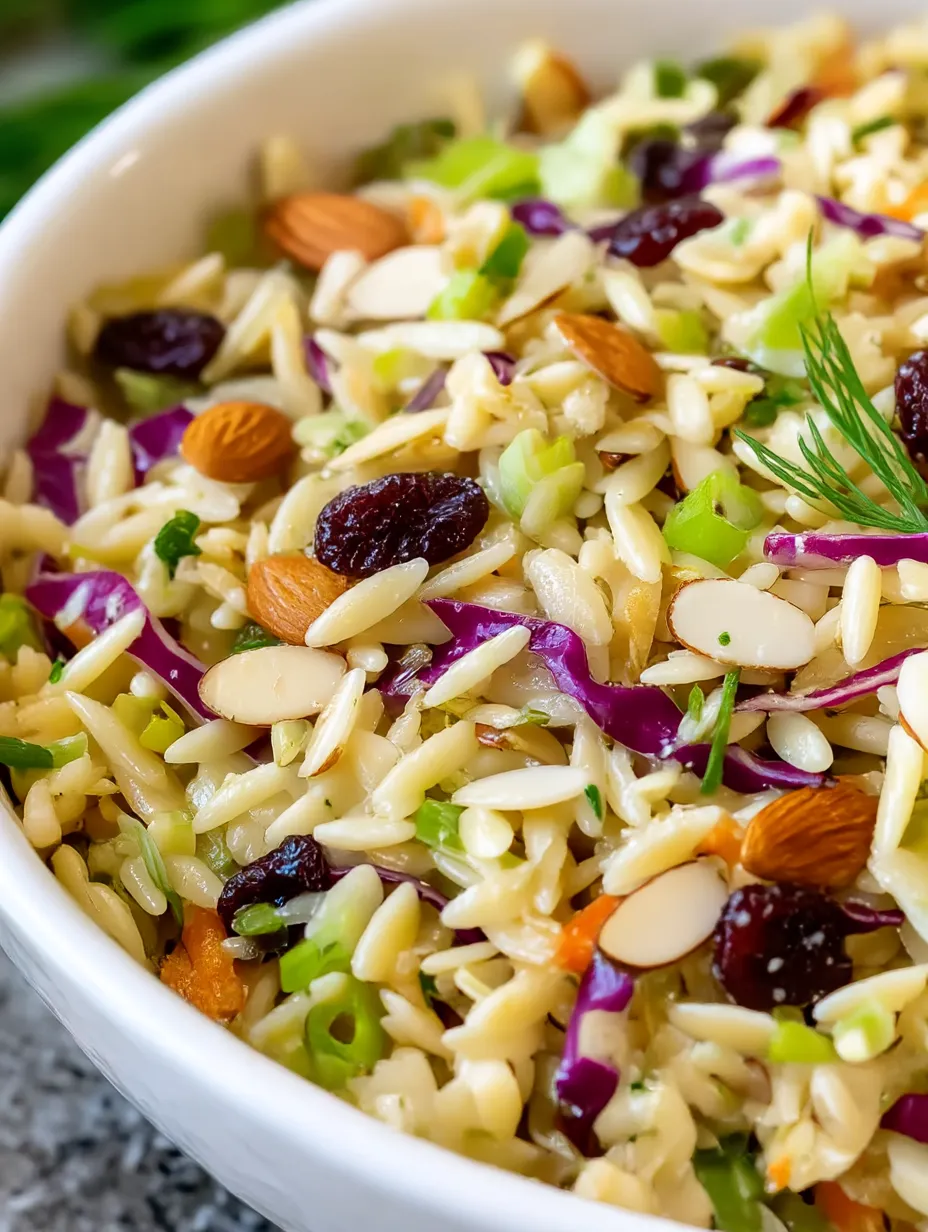 A bowl of rice with nuts and vegetables.